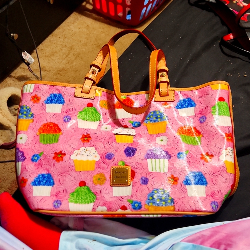 Dooney and Bourke cupcake pursebarely used. No stains or tears. Cupcake. Pink
